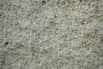 Close-up of the bubbly surface of a concrete building block