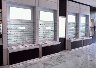 Eyeglasses displayed neatly on shelves in modern optical store, showcasing variety and style for customers seeking vision correction and fashion.