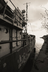 sunken and broken ships in a destroyed port in Ukraine during the war