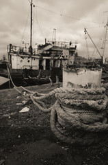 sunken and broken ships in a destroyed port in Ukraine during the war