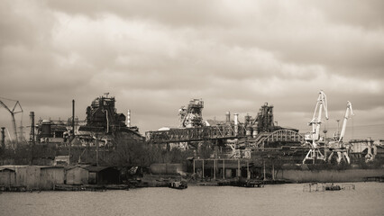 sunken and broken ships in a destroyed port in Ukraine during the war