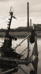 sunken and broken ships in a destroyed port in Ukraine during the war