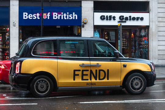 Promotional black London cab wrapped with Fendi advertising