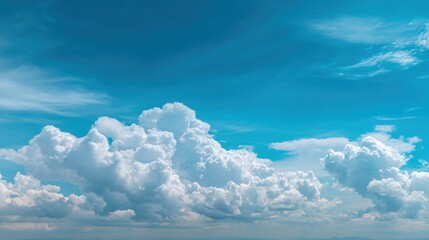 Dramatic clouds in blue sky cumulus formations in airy atmospheric scene
