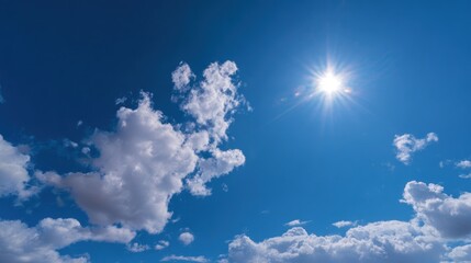 Bright blue sky with fluffy white clouds and shining sun light