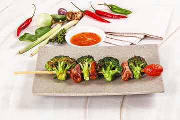 Thai Street foof satay with bacon and broccoli