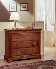 Close up of a classic style wooden bedroom dresser
