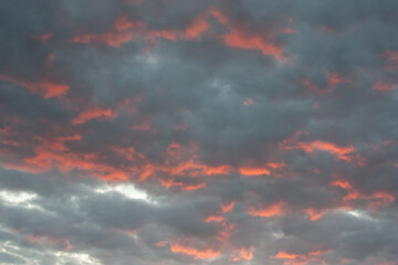 Awesome sunset and dark clouds with pink tones. Image template of textured sky. Gorgeous photo wallpaper. Bright epic sky. Dramatic evening light and fiery orange sunset. Beauty of cloudy sunset