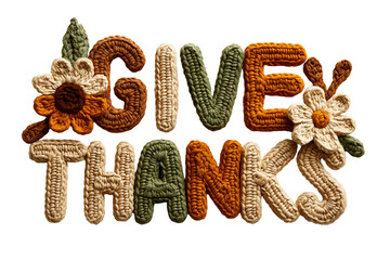 Give thanks text made from crocheted knitted yarn letters in autumn fall colors with handmade flower decorations on transparent background for thanksgiving holiday greeting.
