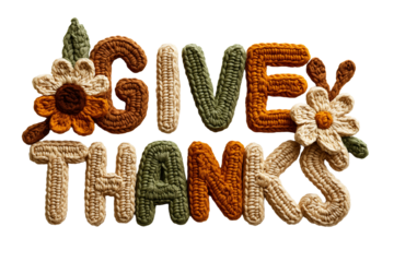 Give thanks text made from crocheted knitted yarn letters in autumn fall colors with handmade flower decorations on transparent background for thanksgiving holiday greeting.