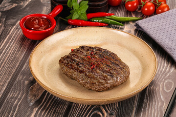 Grilled beef burger cutlet with sauce