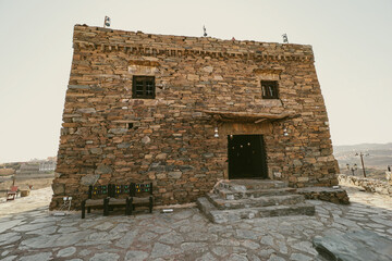 Al baha city ,Aseer Province , Saudi Arabia - September 12, 2022: beautiful historical stone building at Al Malad castle