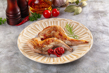 Roasted rabbit leg served rosemary