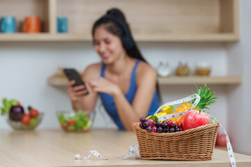 Food Wellness: Colorful Fruit Basket with Healthy Snacks and Digital Engagement