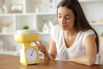Woman cheating scale result weighing food