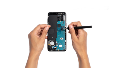 Close up Technician is Repairing Smartphone Isolated on Transparent Background, Top View