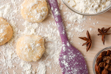 Macro of freshly made anise cookies on wooden bench top