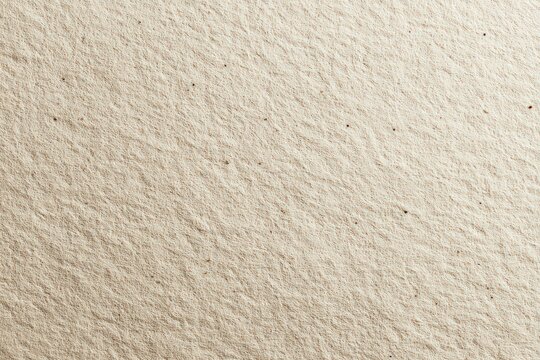 Dense Field of Beige Granules Surface Texture with Uniform Distribution in Soft Lighting