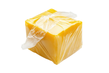 Block of cheddar cheese wrapped in plastic isolated on transparent background. Bouillon cube unwrapped isolated on white background.