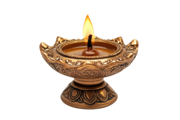 Ornate clay diya with burning flame isolated on transparent background. Diwali diya oil lamp isolated on white background.