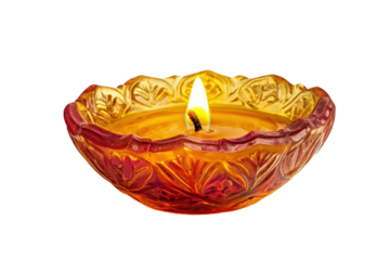 Ornate clay diya with burning flame isolated on transparent background. Diwali diya oil lamp isolated on white background.