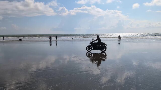 Enjoying a sunny day at the beach with friends, riding bikes, and creating memorable moments by the shore of a beautiful ocean, Cox Bazar, Chattogram Bangladesh - October 24, 2025