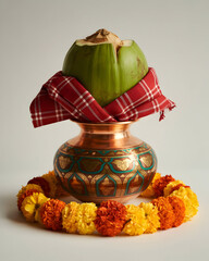 Traditional indian kalash symbol of auspiciousness with coconut and marigold flowers
