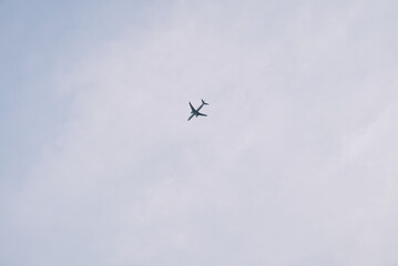 Airplane Flying in the Sky with Minimal Clouds