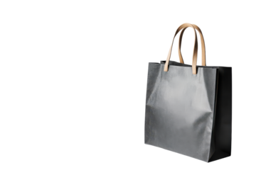 Shiny gray gift bag with handles isolated on transparent background. Gray shopping bag standing on white background.
