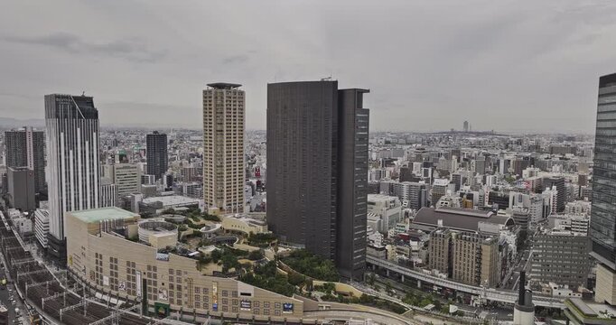 Osaka Japan Aerial v123 flyover Nanbanaka around Namba Parks capturing an upscale retail shopping mall in Naniwa ward and cityscape under overcast sky - Shot with Mavic 3 Pro Cine - Oct 10th 2023