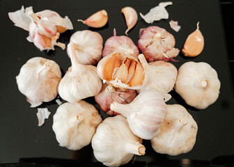 Heap of natural garlic close-up aromatic spice and rustic kitchen still life