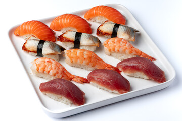 Nigiri set with shrimp, salmon, tuna and eel on a white background isolated