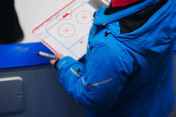 Hockey match game on ice rink arena stadium, team of ice hockey professional players with coach, stick and puck, team of hockey players in protective sport uniform training, hockey league championship