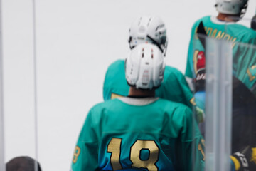 Hockey match game on ice rink arena stadium, team of ice hockey professional players with coach, stick and puck, team of hockey players in protective sport uniform training, hockey league championship