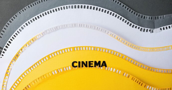 Film strips overlap, creating circular pattern. Bold cinema text centered on yellow strip. Black background provides contrast.