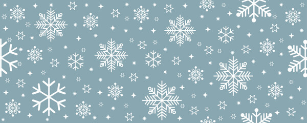 Horizontal banner with scattered white snowflakes and stars on a muted blue-gray background. Modern vector design perfect for winter holiday banners and greeting card backgrounds.