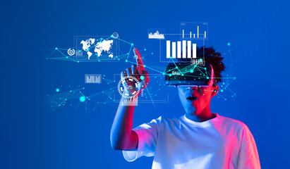 A young individual interacts with a virtual reality setup showcasing various data visualization elements, emphasizing analytics and innovative technology on a vibrant blue background. XDMCP