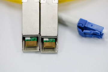 Enabling high-speed data transmission, this coiled fiber patch cord and its blue connectors work in...