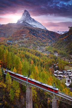 Zermatt, Switzerland. Image of Swiss Alps with Gornergrad tourist train and Matterhorn in Valais region at autumn sunset.