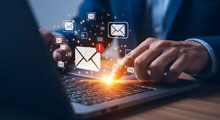 Businessman using a laptop with glowing email icons and notifications appearing, symbolizing digital communication and online messaging