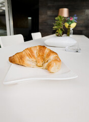 tasty croissant with sugar crystals