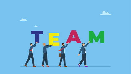 Fototapeta premium Business team people walking together holding the word TEAM. Team working together to win business success, teamwork, cooperation or collaboration, coworker partnership or office colleagues.