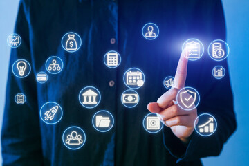 Touching digital icons on a screen while exploring business opportunities and financial growth in a modern office setting