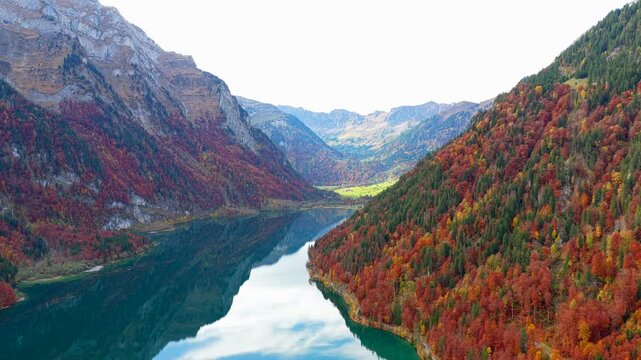 Cinematic Aerial Journey through the Swiss Countryside in Fall. Lake & Autumn