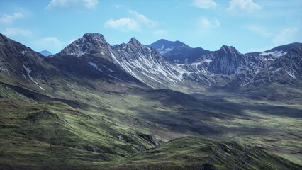 Fototapeta premium Surrounded by towering mountains, green valleys stretch across the land, basking under a clear blue sky. Snow capped peaks rise majestically above the serene scene, showcasing natures beauty.