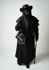 Plague Doctor Full length walking Silhouette Portrait of Gothic Halloween Character with Beak Mask, Black Cloak on White Studio Background, Dramatic Dark Costume and Fantasy Horror figure