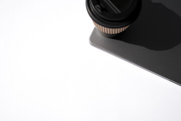 Paper Coffee Cup on Laptop. Coffee Break at Work.     