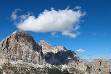 Fototapeta premium Mountain landscape with blue sky and big white cloud