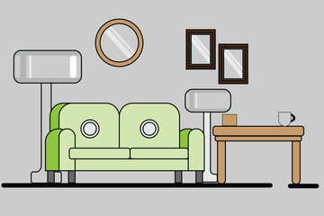 A green sofa and a table with a cup in a living room