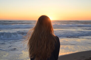 Golden sunset, woman on beach, contemplation